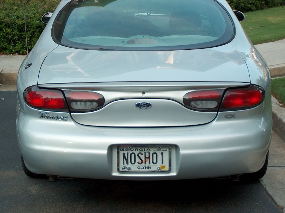 Rear view of a silver 1998 Ford Taurus with a Georgia license plate
