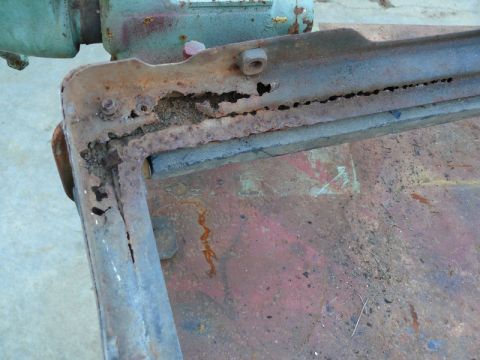 1976 Chevrolet Corvette - This heavily corroded metal component shows significant rust and damage, indicating it is a worn-out part.