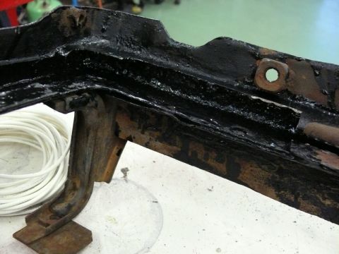 1976 Chevrolet Corvette - Close-up of a corroded metal component, possibly from a vehicle chassis.
