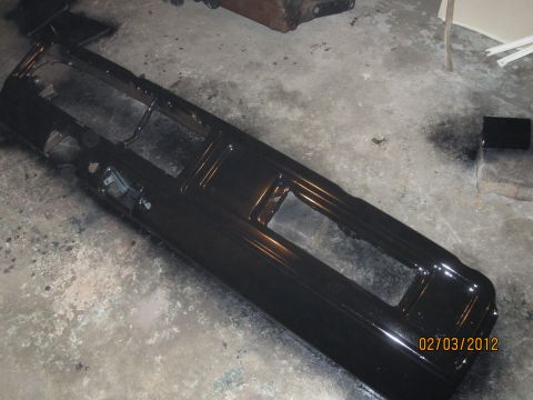 1979 Ford Bronco - A black dashboard frame is shown, likely awaiting installation or restoration.