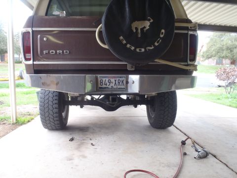 1979 Ford Bronco - The rear of a 1979 Ford Bronco, its spare tire cover and a chrome bumper.