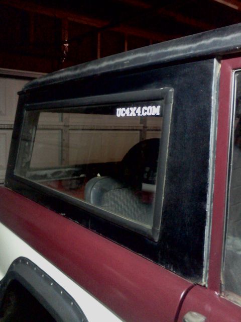 1968 Ford Bronco - This 1968 Ford Bronco shows a side profile with a visible website sticker on the rear window.