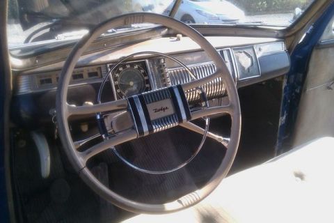 1991 Ford Crown Victoria - Interior view of a vintage Dodge car, showing the steering wheel and dashboard.