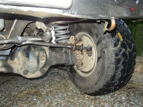 1989 Ford Bronco - Close-up of the front axle and suspension system on a 1989 Ford Bronco.