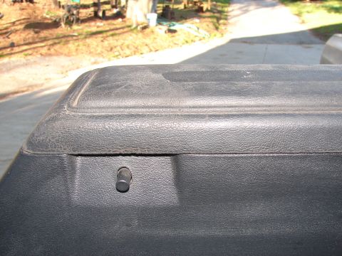 1973 Ford Ranchero - Close-up of a black plastic bedliner with a small silver pin.