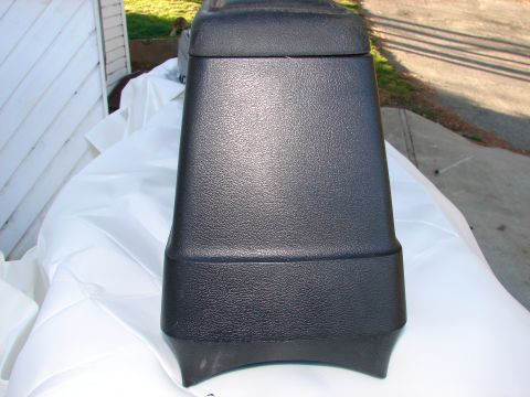 1973 Ford Ranchero - Close-up of a black plastic automotive center console part.