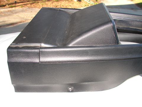 1973 Ford Ranchero - Close-up view of a black plastic interior trim piece, possibly from a vehicle's dashboard or console.