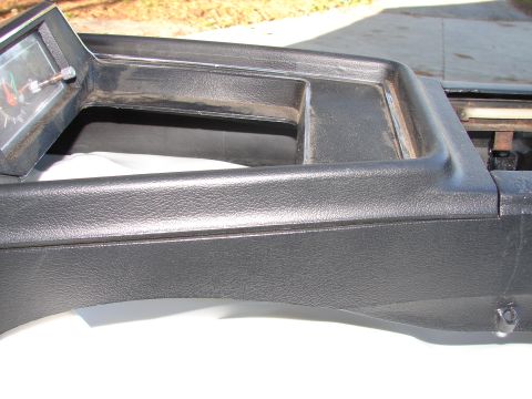 1973 Ford Ranchero - Dashboard trim with an inset gauge, showing red and green markings.
