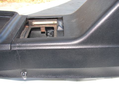 1973 Ford Ranchero - This is a close-up of a car's center console, showing a section with an open compartment and some internal components.
