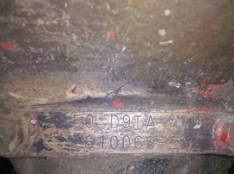 1979 Ford Bronco - A close-up view of a stamped metal plate showing identification numbers and letters.