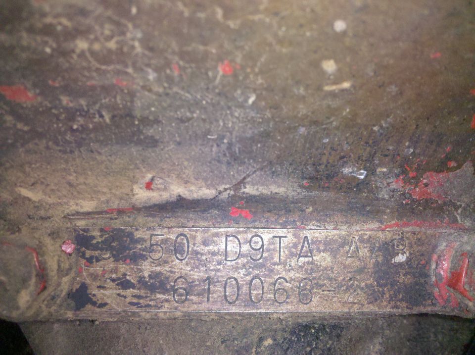 Stamped metal plate with numbers 50 D9TA A B and 610066-2