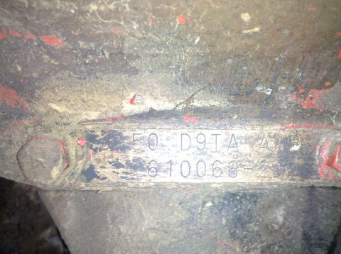 1979 Ford Bronco - Close-up of a stamped metal plate showing identification numbers.