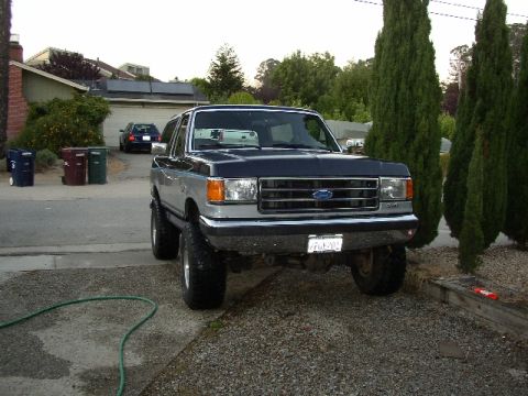 1989 Ford Bronco - This lifted Ford Bronco has a two-tone paint scheme and appears to be from the late 1980s.