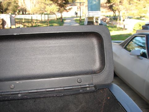 1973 Ford Ranchero - A partial view of a truck bed cover is shown, with a white vehicle in the background.