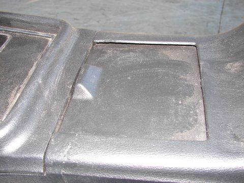 1973 Ford Ranchero - Dashboard trim piece from a car interior, showing a textured plastic surface.