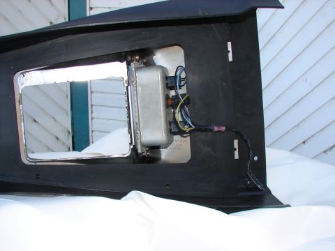 1973 Ford Ranchero - Close-up of a vehicle part, possibly a headlight housing, with wiring and electrical components.