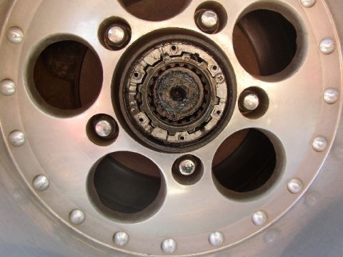 1989 Ford Bronco - The wheel hub assembly shows a locking mechanism with visible wear and tear.