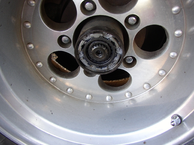 Close-up of exposed front hub and locking hub inside an alloy wheel center