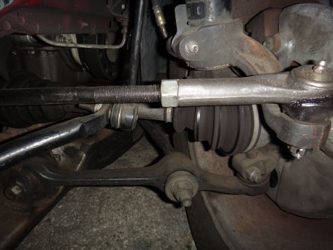 1993 Ford Taurus - Close-up view of the front suspension steering and control arm components.