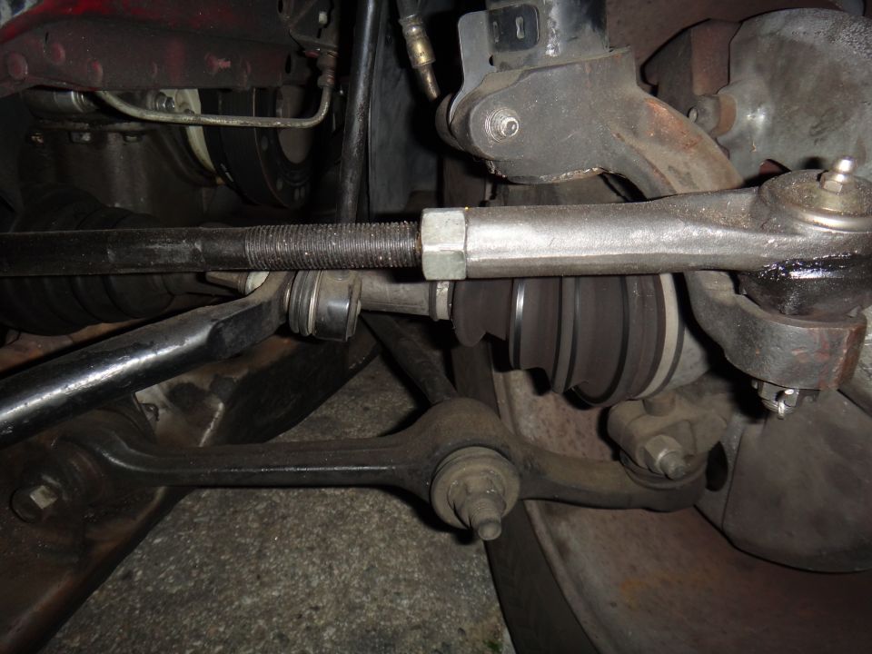 Front suspension tie rod and control arm assembly