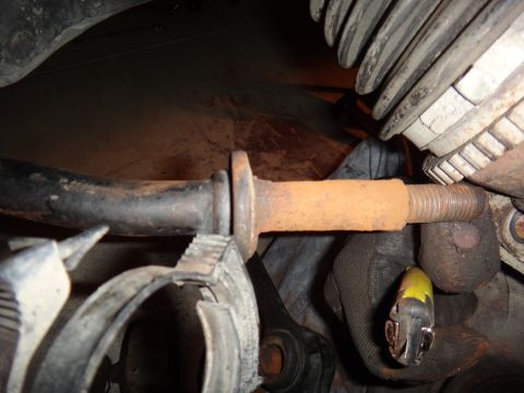 1993 Ford Taurus - Close-up view of a rusted suspension part, likely from a vehicle's undercarriage.