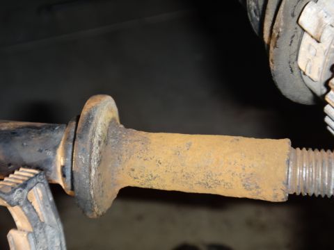 1993 Ford Taurus - A corroded metal part, likely from a vehicle's suspension system, shows significant rust.