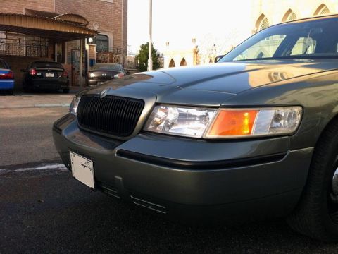 2001 Mercury Grand Marquis - The front grille and headlights of a Mercury Grand Marquis are visible in this close-up shot.