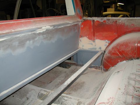 1960 Ford Ranchero - The bed of a 1960 Ford Ranchero shows primer and metal bracing during restoration.