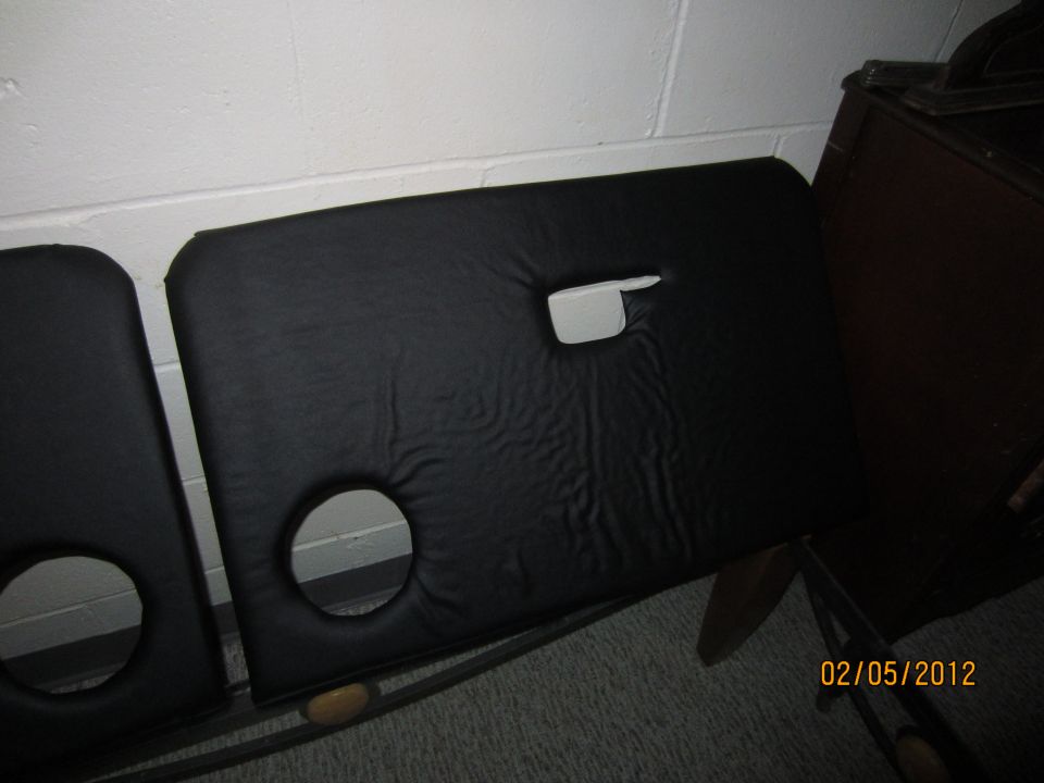 Two black car door panels with circular cutouts and a handle slot