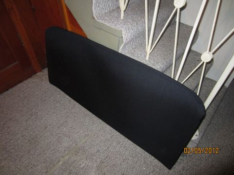 1979 Ford Bronco - A black automotive part is shown resting on carpeted stairs, with a date stamp of 02/05/2012.