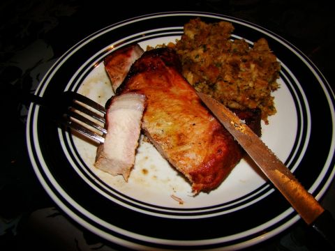 1989 Ford Bronco - A close-up view of a meal pork chops and stuffing, ready to be eaten.