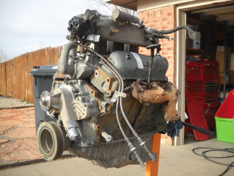 1992 Ford Explorer - Engine assembly on an orange stand, with a Supermotors.net logo in the lower right corner.