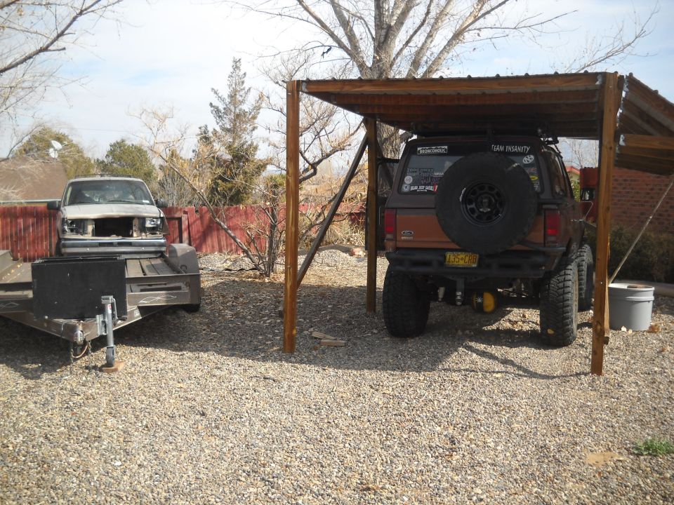 Brown SUV's rear view, spare tire mounted, 1992 license plate visible