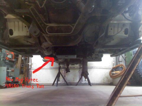 1996 Ford Bronco - A new Mag-Hytec 4R100 transmission pan is installed on the underside of a vehicle.