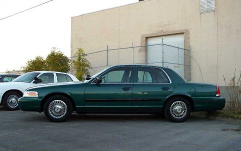 1998 Ford Crown Victoria - A side view of that beautiful green P71.