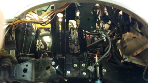 1996 Ford Bronco - Close-up view of engine bay components and suspension modifications.