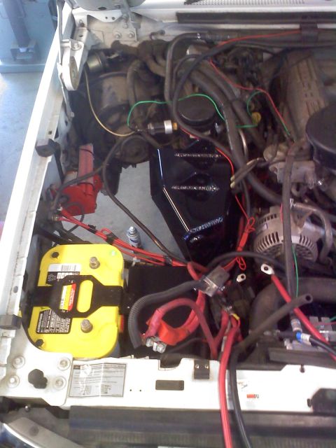 1996 Ford Bronco - Engine bay view showing a yellow Optima battery and complex wiring system.
