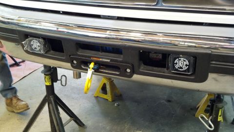 1996 Ford Bronco - Front bumper of a 1996 Ford Bronco, fitted with a winch and auxiliary lights.