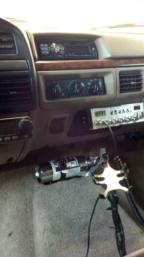 1996 Ford Bronco - The interior of a 1996 Ford Bronco is visible, a CB radio and a fire extinguisher.