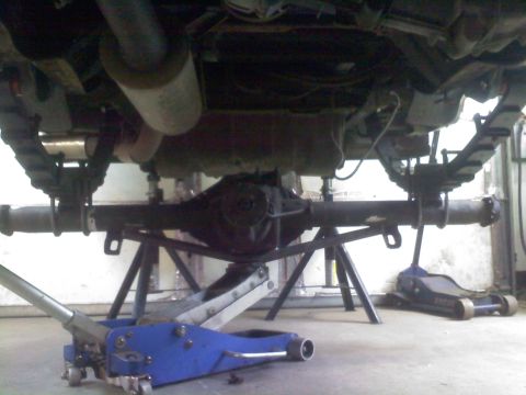 1996 Ford Bronco - The rear axle and suspension components are visible as the vehicle is raised for service.