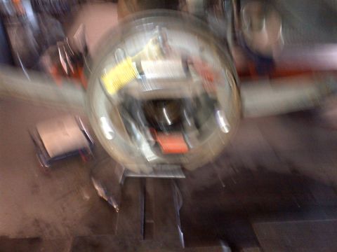 1965 Ford Mustang - Close-up of a blurred brake drum assembly, showing internal components.