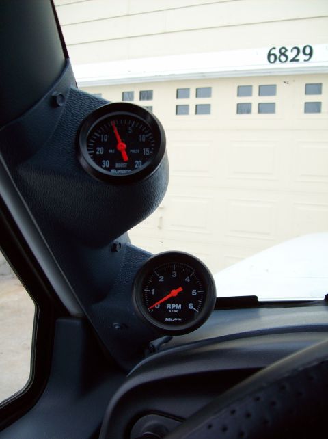 1993 Ford F-150 - Interior view of a vehicle's dashboard showing boost and RPM gauges.