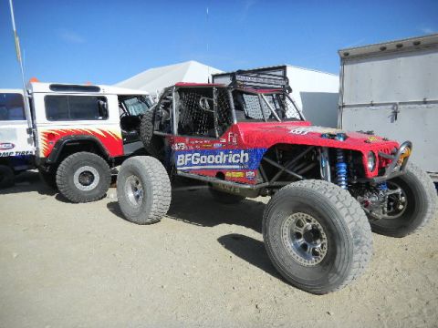 1997 Ford Ranger - A custom off-road buggy and a support vehicle are parked on a dirt lot under a clear blue sky.