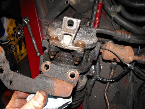 1982 Chrysler New Yorker - That's the 82's steel bracket we're ditching. We're keeping the aluminum tab that bolts to the other side of the compressor mount.