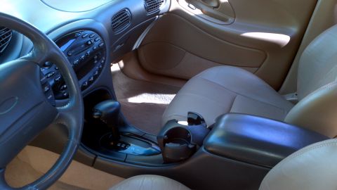 1996 Ford Taurus - Interior view of a 1996 Ford Taurus, highlighting the dashboard, shifter, and seating.