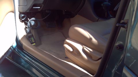 1996 Ford Taurus - The interior of a 1996 Ford Taurus features tan leather seats and a tan dashboard with dark gray dashboard.