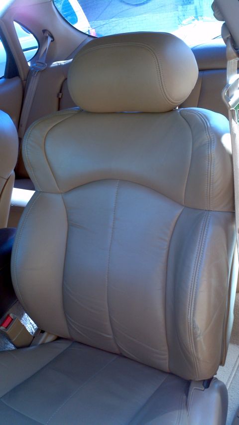 1996 Ford Taurus - Interior view of car seats, showing the upholstery and seat belt system.