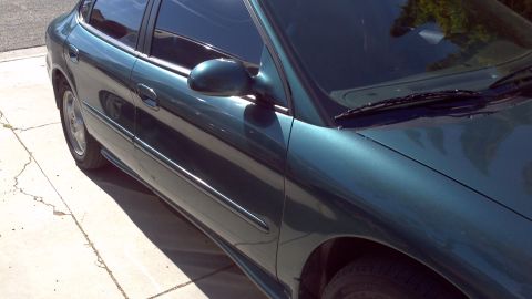 1996 Ford Taurus - Driver's side of a 1996 Ford Taurus sedan parked on a driveway.