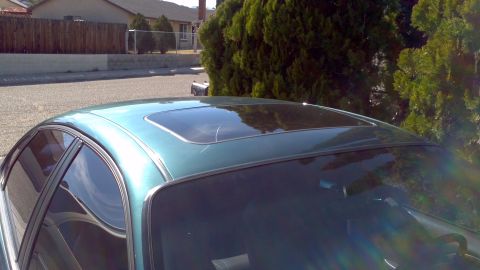 1996 Ford Taurus - The image shows the top of a car, focusing on the sunroof and surrounding roof panel.