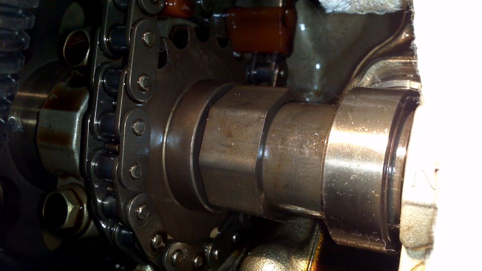 Close-up of engine camshaft and timing chain mechanism